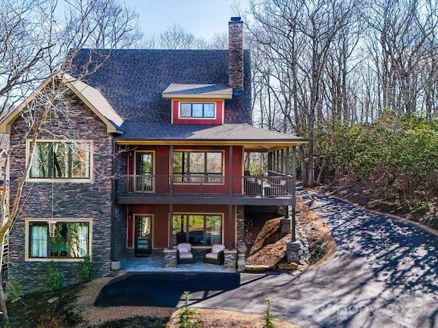 rear view of property with a patio