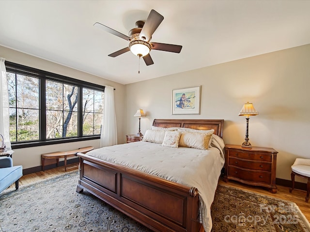 bedroom featuring hardwood / wood-style flooring and ceiling fan