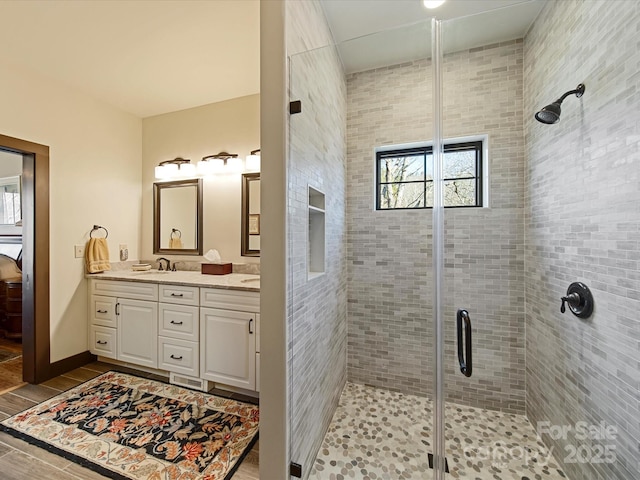 bathroom with vanity and an enclosed shower