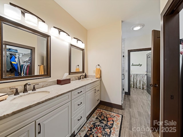 bathroom with vanity and walk in shower