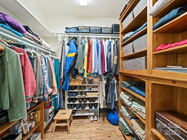 spacious closet with light hardwood / wood-style floors