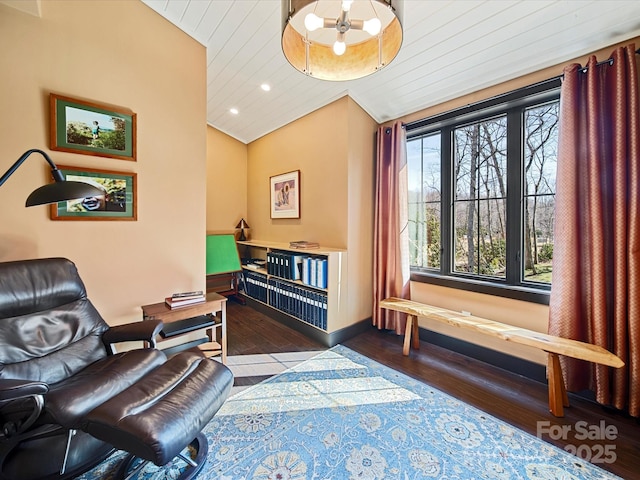 sitting room with dark hardwood / wood-style flooring, wood ceiling, and lofted ceiling