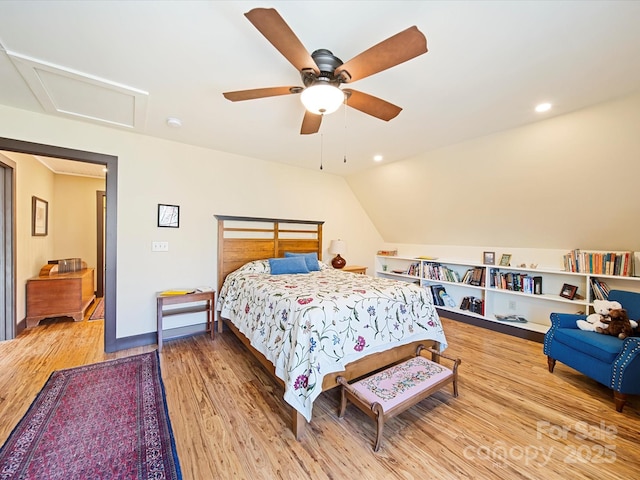 bedroom featuring ceiling fan, lofted ceiling, and hardwood / wood-style floors