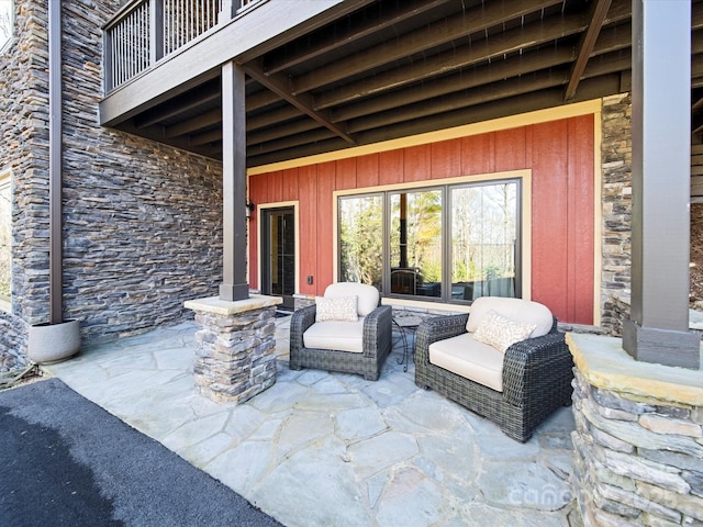 view of patio featuring a balcony