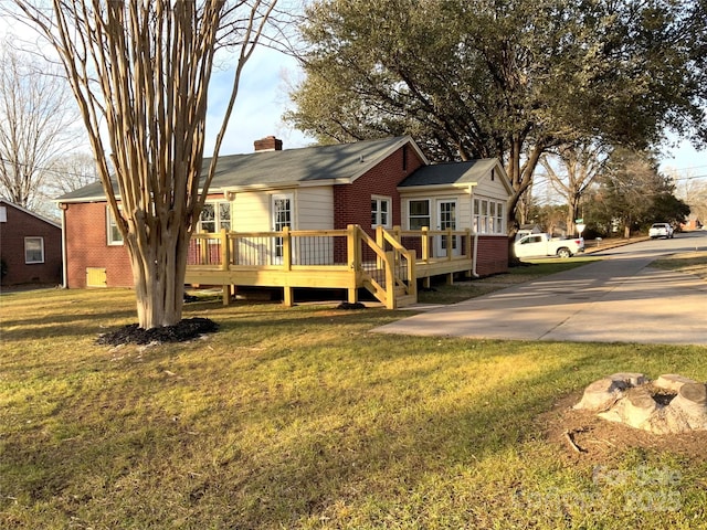 exterior space featuring a yard and a deck