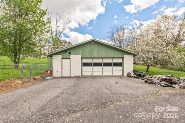 garage with a yard