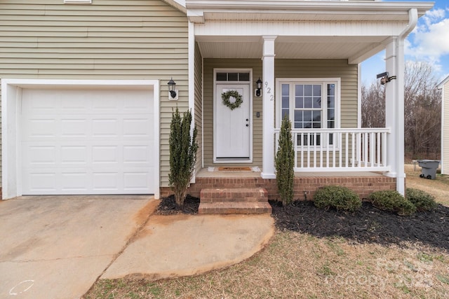 view of exterior entry with a garage