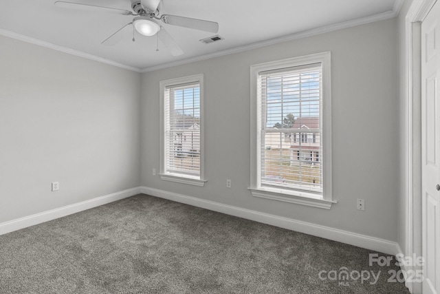 spare room with crown molding, carpet, and ceiling fan