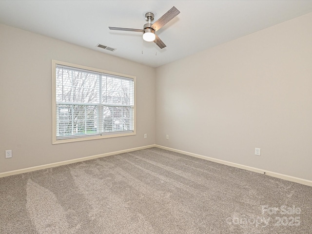 carpeted empty room featuring ceiling fan