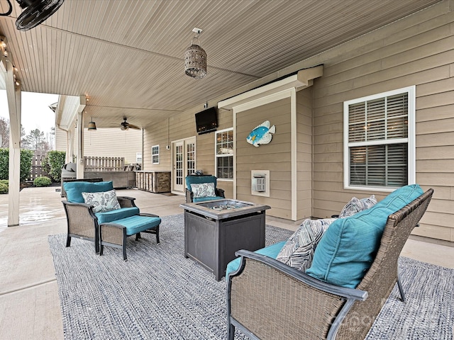 view of patio / terrace featuring an outdoor living space with a fire pit and ceiling fan