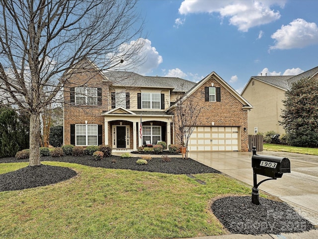 view of front of home featuring a garage and a front lawn