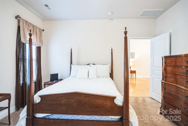 bedroom with light carpet