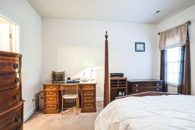 bedroom featuring light colored carpet