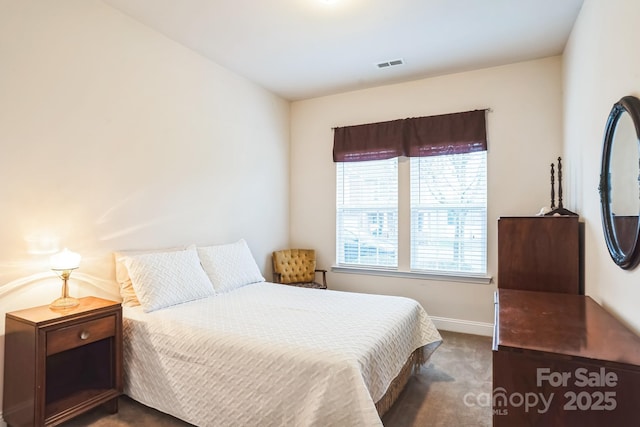 bedroom with dark carpet