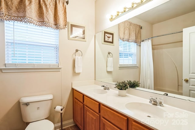 bathroom with a shower with curtain, vanity, and toilet