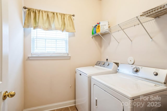 laundry room with washing machine and clothes dryer