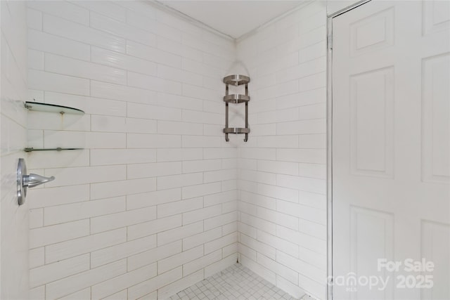 bathroom with tiled shower