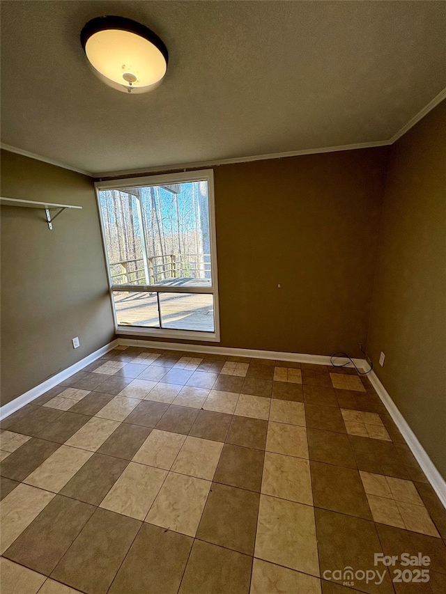 tiled empty room with crown molding