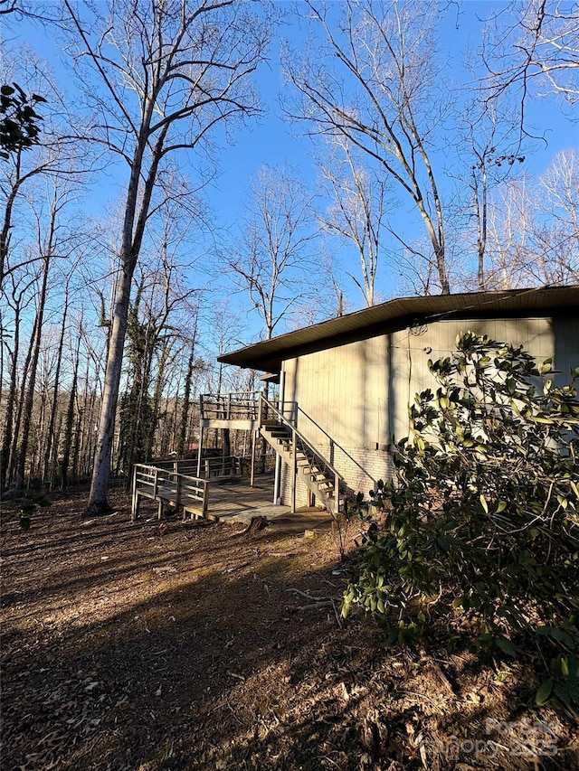 view of side of home with a deck