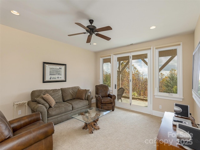 living room featuring ceiling fan and carpet floors