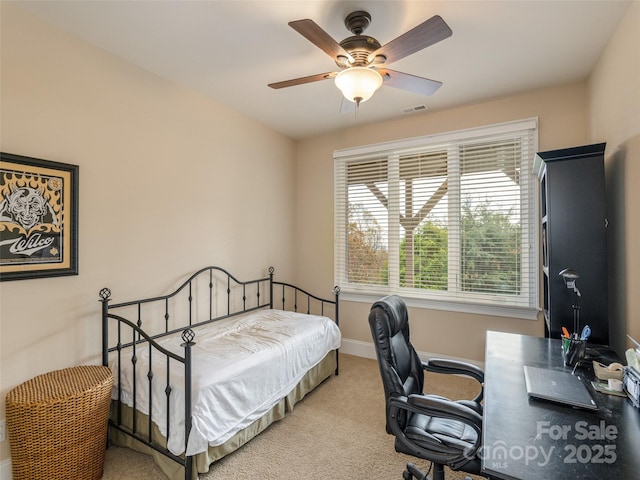 carpeted bedroom with ceiling fan