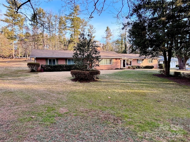 ranch-style house with a front lawn