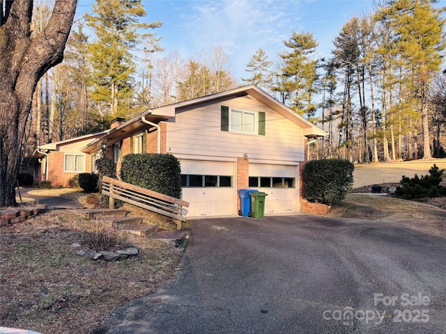 view of side of home with a garage