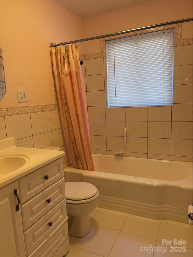 full bathroom featuring tile walls, shower / bath combination with curtain, vanity, toilet, and tile patterned floors