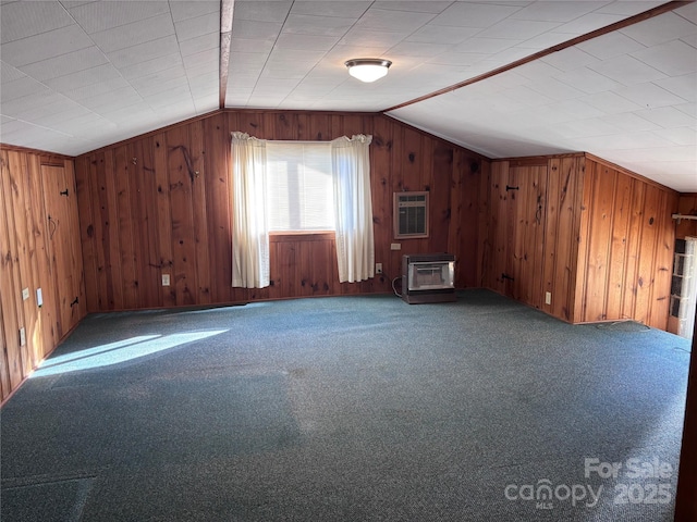 bonus room with carpet floors, lofted ceiling, a wood stove, and an AC wall unit