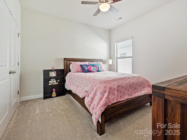 bedroom featuring ceiling fan and light colored carpet