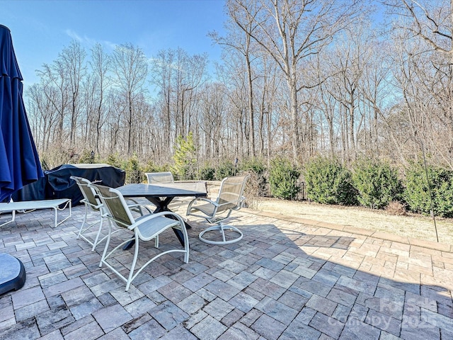 view of patio featuring outdoor dining area