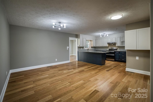 kitchen featuring sink, white cabinetry, electric range, a textured ceiling, and light wood-type flooring