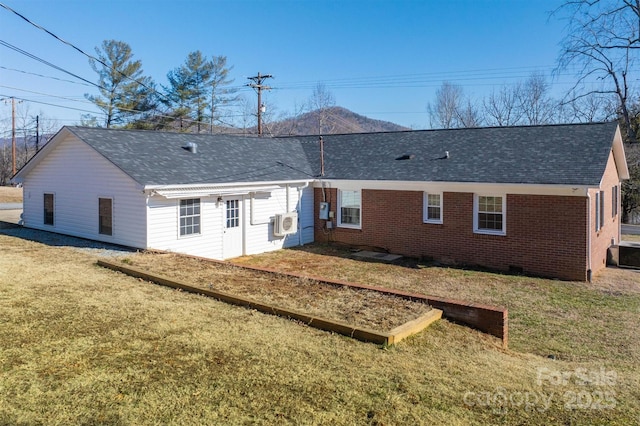 rear view of house with a lawn