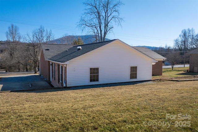 view of property exterior featuring a yard