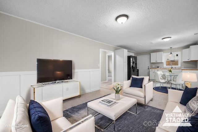 carpeted living room featuring a textured ceiling