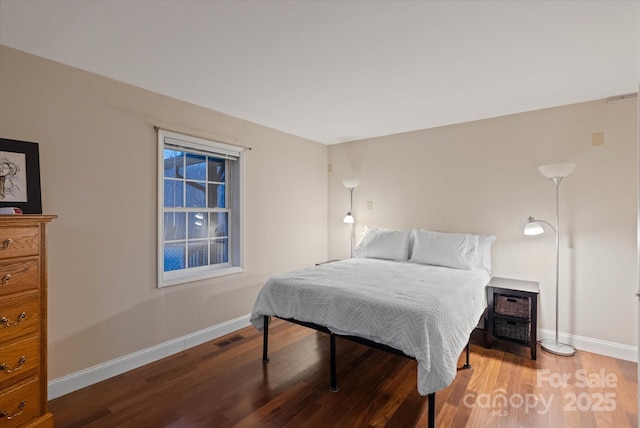 bedroom with hardwood / wood-style floors