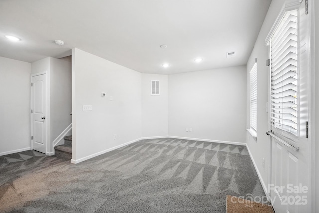 empty room featuring carpet flooring