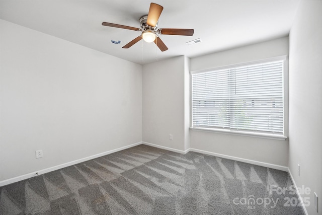 spare room with ceiling fan and carpet flooring