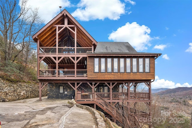 back of house with a mountain view