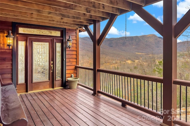 wooden terrace with a mountain view