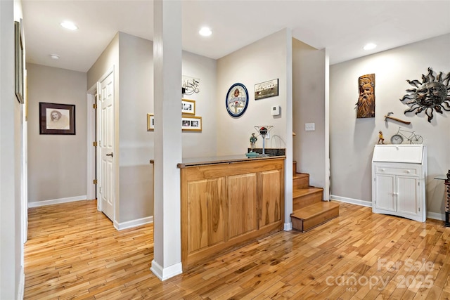 hall with light hardwood / wood-style flooring