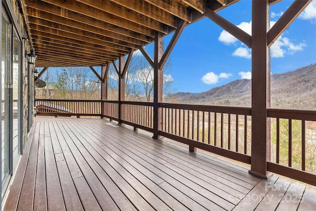 wooden deck featuring a mountain view