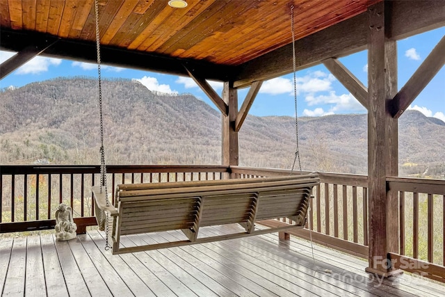 wooden terrace with a mountain view