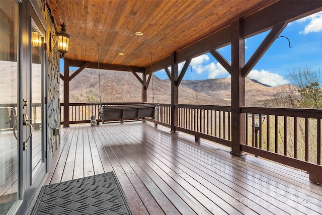 wooden deck featuring a mountain view