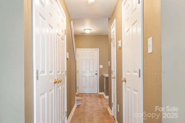 7117 Flying Scotsman Dr, Charlotte, NC 28213 - corridor featuring light wood-type flooring and baseboards