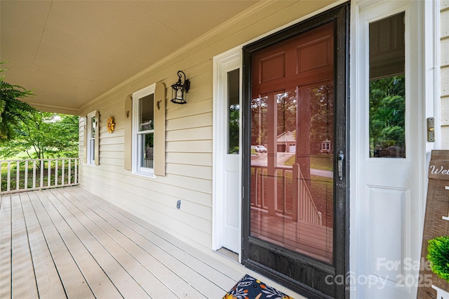 doorway to property with covered porch