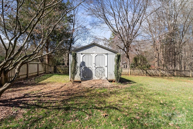 view of shed featuring a fenced backyard