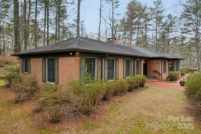 view of property exterior with a lawn