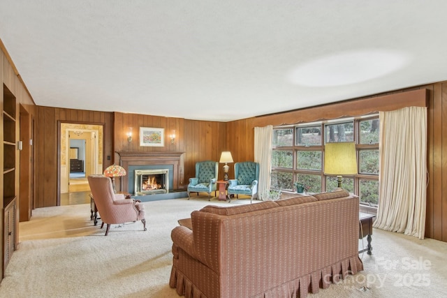 living room featuring light colored carpet and wooden walls