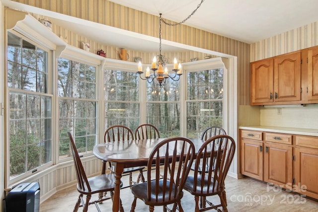 dining area with a notable chandelier